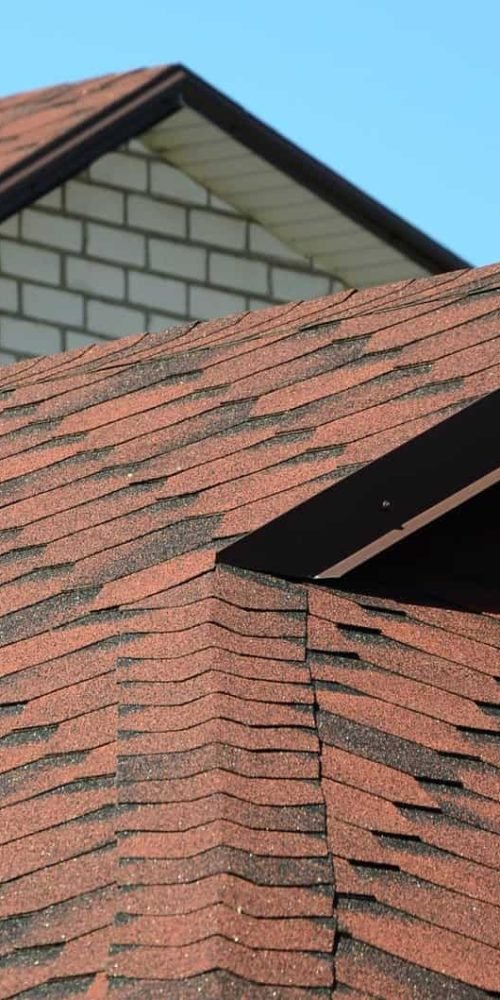 The roof is covered with bituminous shingles of brown color. Quality Roofing